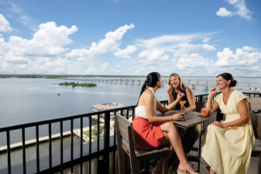 Enjoying cocktails at a rooftop bar on the river